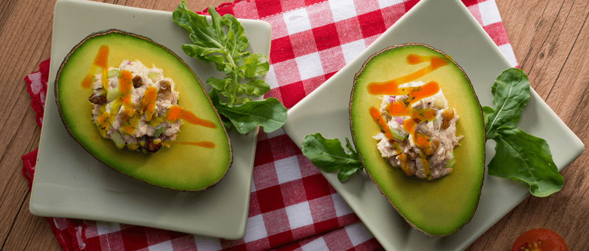Chicken Stuffed Avocados in Pumpkin Mole Sauce
